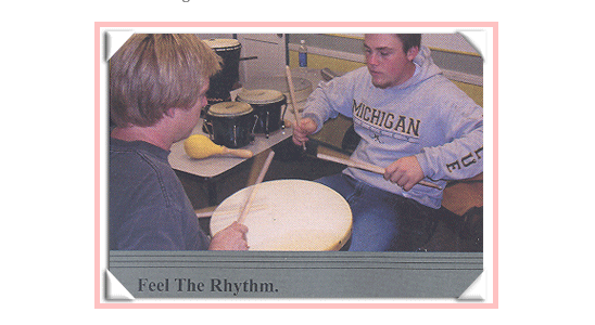 Todd and Student drumming together in class.